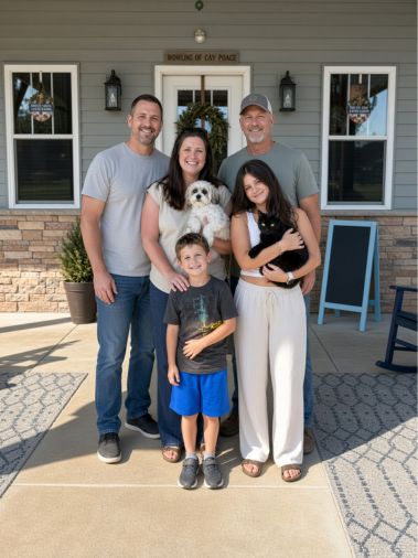 A family welcoming puppies at South Carolina Dog Club