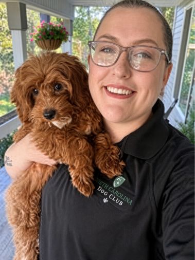 South Carolina Dog Club pet counselor holding a puppy